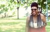 black-woman-with-braids-standing-in-park.jpg